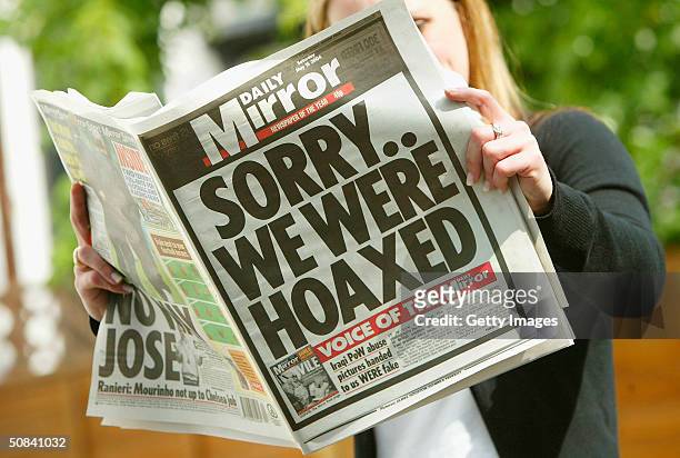 The front page of London's Daily Mirror newspaper is seen in this photo illustration with a headline apologizing for running fabricated pictures...