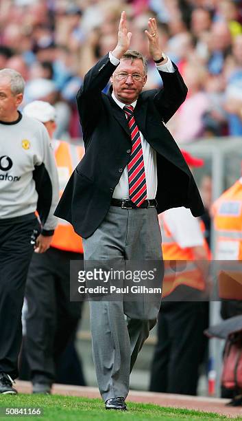 Sir Alex Ferguson of Manchester United applauds the fans at the end of the FA Barclaycard Premiership match between Aston Villa and Manchester United...