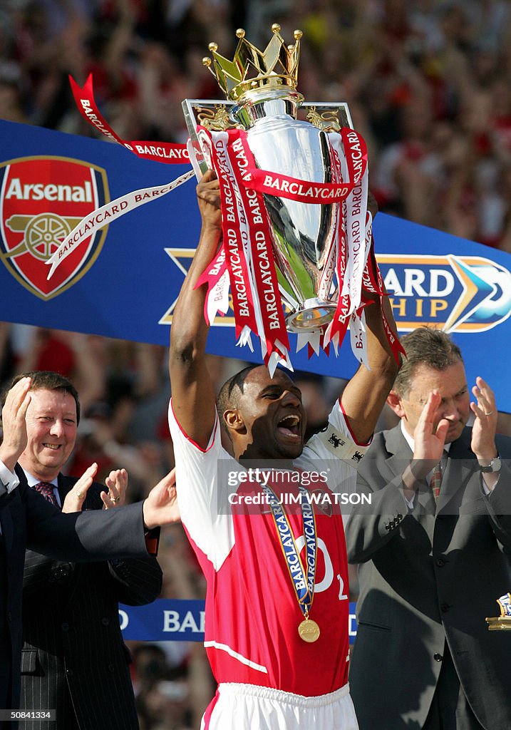 Arsenal's captain Patrick Vieira holds u