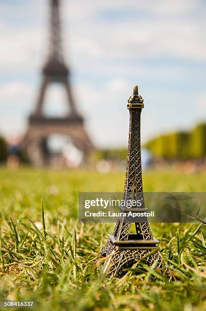 miniature of the eiffel tower in paris - eiffel tower stock-fotos und bilder