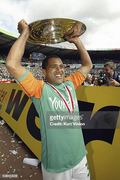 Werder Bremen's Ailton celebrates his teams Bundesliga Championship with the trophy in Bremen May 15, 2004 in Bremen, Germany. Werder Bremen sealed...