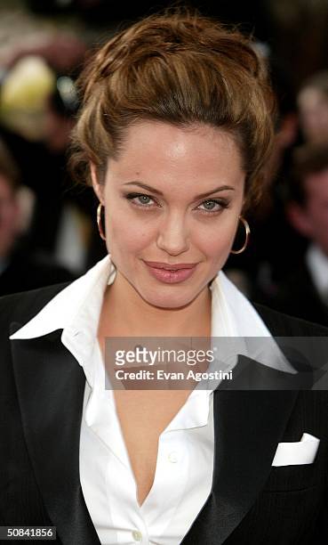 Actress Angelina Jolie attends the screening of the film "Shrek 2" at the Palais des Festivals during the 57th International Cannes Film Festival May...