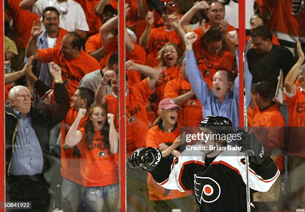 Jeremy Roenick of the Philadelphia Flyers celebrates a goal by Mark Recchi against the Tampa Bay Lightning in Game four of the 2004 NHL Eastern...