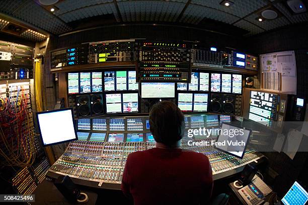 Playoffs: Rear view of Fox Sports audio mixer Fred Aldous in production booth during telecast of Arizona Cardinals vs Carolina Panthers NFC...