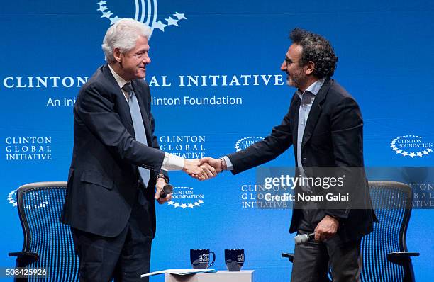 Former President Bill Clinton speaks with founder of Tent Foundation Hamdi Ulukaya at The Clinton Global Initiative Winter Meeting at Sheraton New...