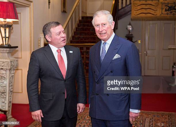 Prince Charles, Prince of Wales greets King Abdullah II of Jordan at Clarence House on February 4, 2016 in London, United Kingdom. The Prince of...