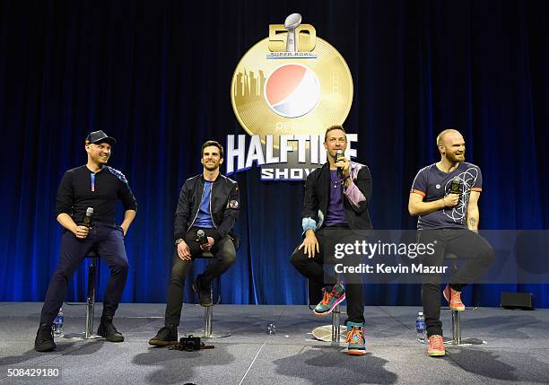 Musicians Jonny Buckland, Guy Berryman, Chris Martin and Will Champion of Coldplay speak onstage at the Pepsi Super Bowl Halftime Press Conference on...