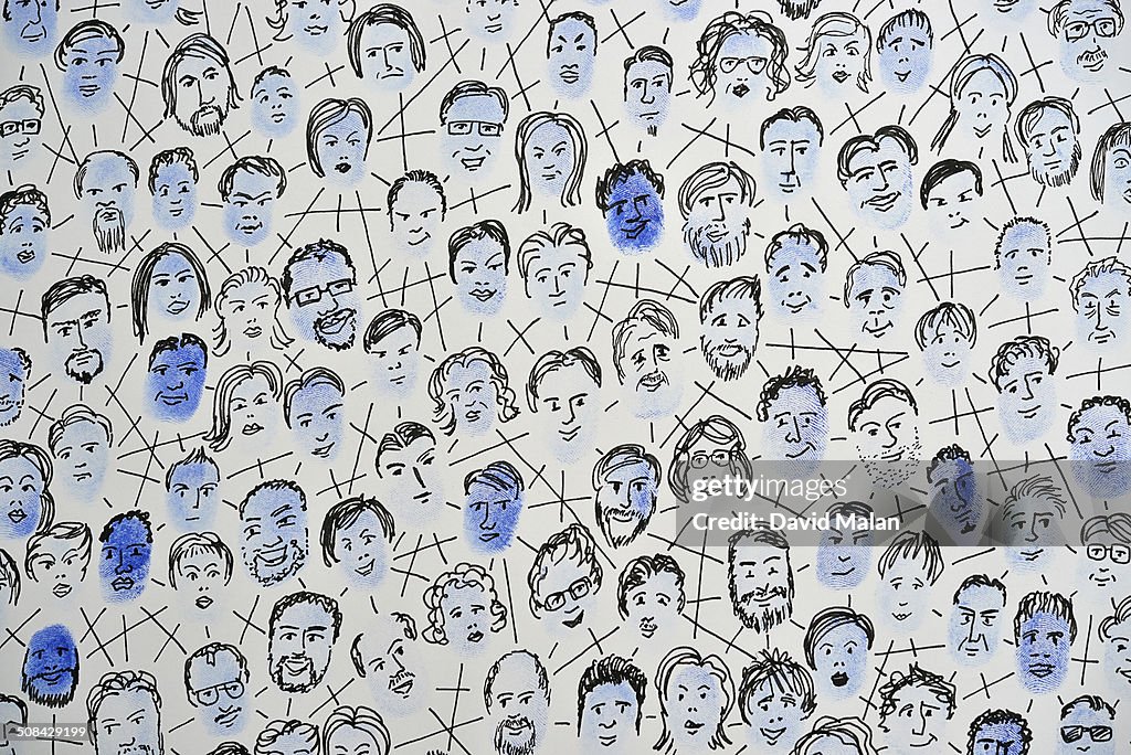 Connected fingerprints with faces drawn on them