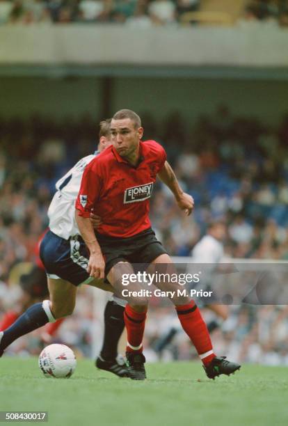 English footballer Vinnie Jones playing for Wimbledon against Tottenham Hotspur in an English Premier League match at White Hart Lane, London, 30th...