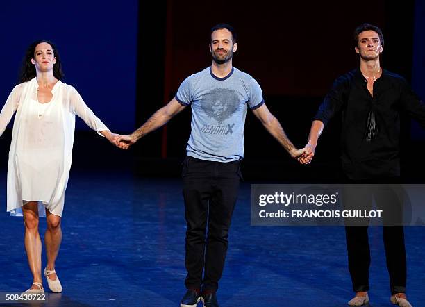 French choreogapher Benjamin Millepiedflanked by dancers greets the public after the rehearsal of "La nuit s'achève" Ballet on February 4, 2016 at...