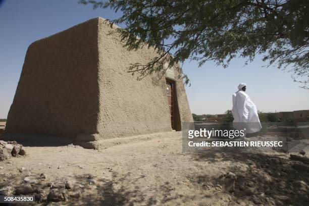 Sane Chirfi, representing the family which looks after the mausoleum of Alpha Moya, poses in front of the mausoleum on February 4, 2016 Timbuktu . -...