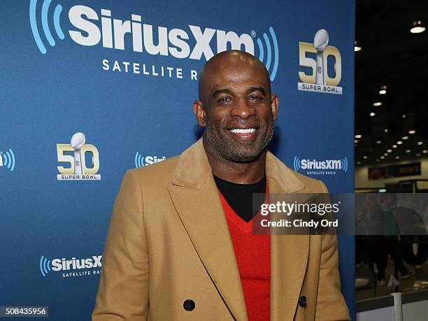 Former NFL player and sportscaster Deion Sanders visits the SiriusXM set at Super Bowl 50 Radio Row at the Moscone Center on February 4, 2016 in San...