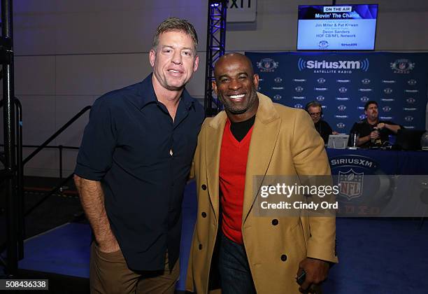 Former NFL players with the Dallas Cowboys Troy Aikman and Deion Sanders visit the SiriusXM set at Super Bowl 50 Radio Row at the Moscone Center on...