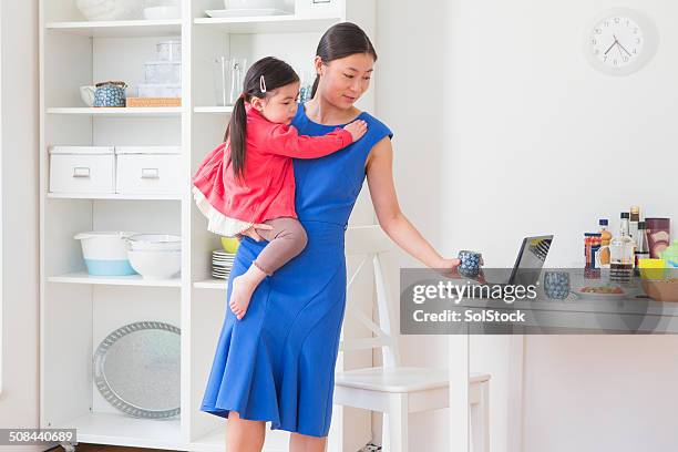 working chinese mother and little girl - busy toddlers stock pictures, royalty-free photos & images