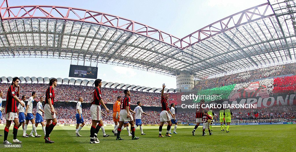 AC Milan's and Brescia's players walk on