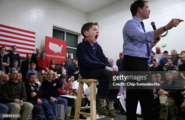 Dominick Rubio joins his father Republican presidential candidate Sen. Marco Rubio on stage during a campaign town hall event at Mary A. Fisk...