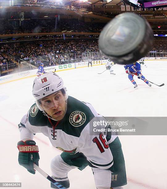 Jason Zucker of the Minnesota Wild keeps his eyes on the puck during the game against the New York Rangers at Madison Square Garden on February 4,...