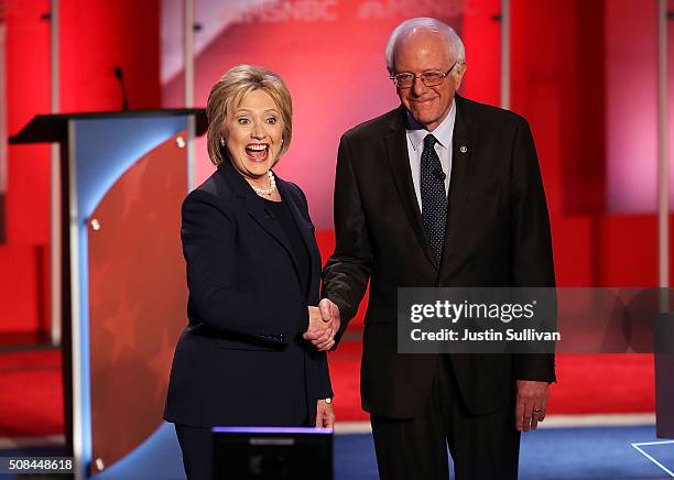 Democratic presidential candidate former Secretary of State Hillary Clinton and U.S. Sen. Bernie Sanders shake hands at the start of their MSNBC...
