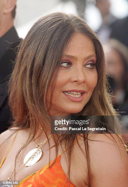 Actress Ornella Muti attends the premiere of movie "Comme Une Image" at the Palais des Festivals on May 16, 2004 in Cannes, France. Muti is wearing...