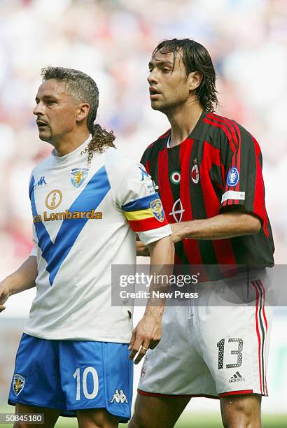 Alessandro Nesta of AC Milan marks Roberto Baggio of Brescia during the Serie A match between AC Milan and Brescia on May 16, 2004 in Milan, Italy.