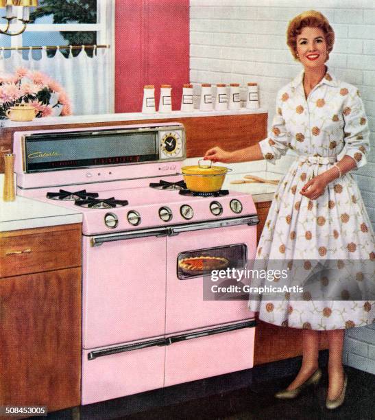 Happy housewife cooks on her new pink range, with a pot on the cooktop and a pumpkin pie in the oven, 1957. Screen print.