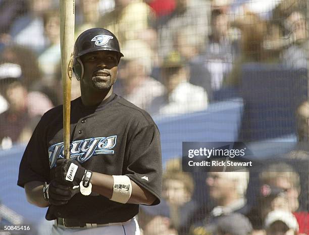 Carlos Delgado of the Toronto Blue Jays watches some dancers while in the on deck circle during a game against the Boston Red Sox on May 16, 2004 at...