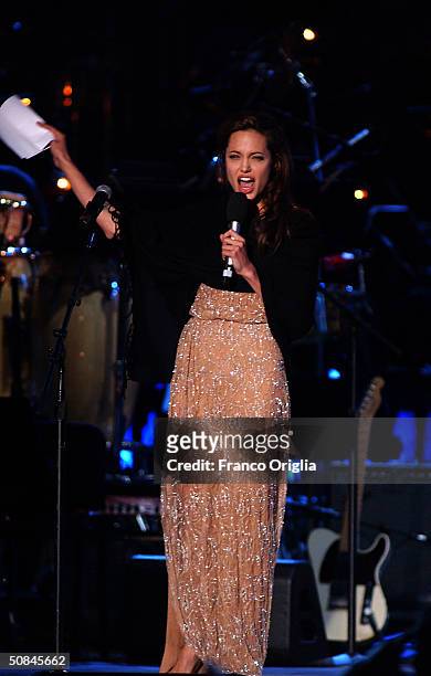 Angelina Jolie performs at "We are the Future" benefit concert produced by music legend Quincy Jones May 16, 2004 in Rome, Italy.