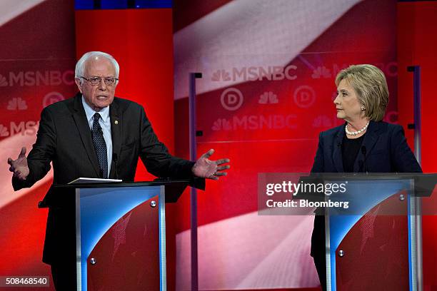 Senator Bernie Sanders, an independent from Vermont and 2016 Democratic presidential candidate, left, speaks as Hillary Clinton, former Secretary of...