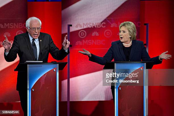 Democratic presidential candidates Hillary Clinton, former Secretary of State, right, and Senator Bernie Sanders, an independent from Vermont, speak...