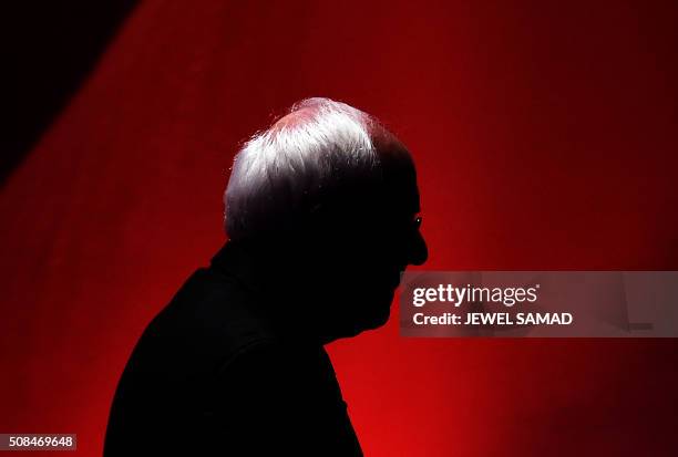 Democratic presidential candidate Bernie Sanders leaves the stage during a break as he participate in the MSNBC Democratic Candidates Debate with...