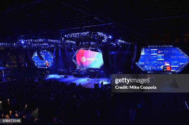 Signage for DirecTV is displayed on the stage's backdrop at the DirecTV and Pepsi Super Thursday Night featuring Dave Matthews Band at Pier 70 on...
