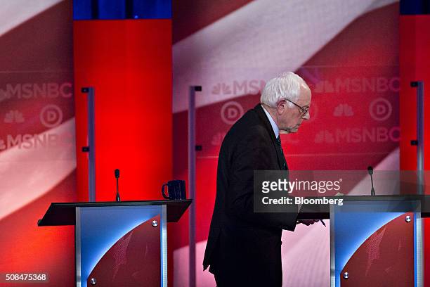 Senator Bernie Sanders, an independent from Vermont and 2016 Democratic presidential candidate, walks off stage during a break in the Democratic...