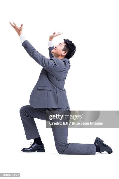 businessman posing - kneeling stock pictures, royalty-free photos & images