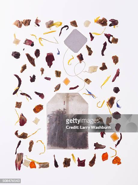 herbs with tea bag over white background - ティーバッグ ストックフォトと画像