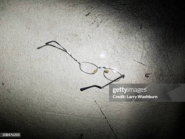 broken eyeglasses on textured floor - broken spectacles stock pictures, royalty-free photos & images