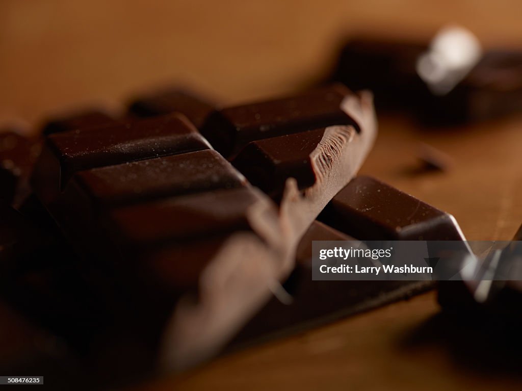 Dark chocolate bars on table