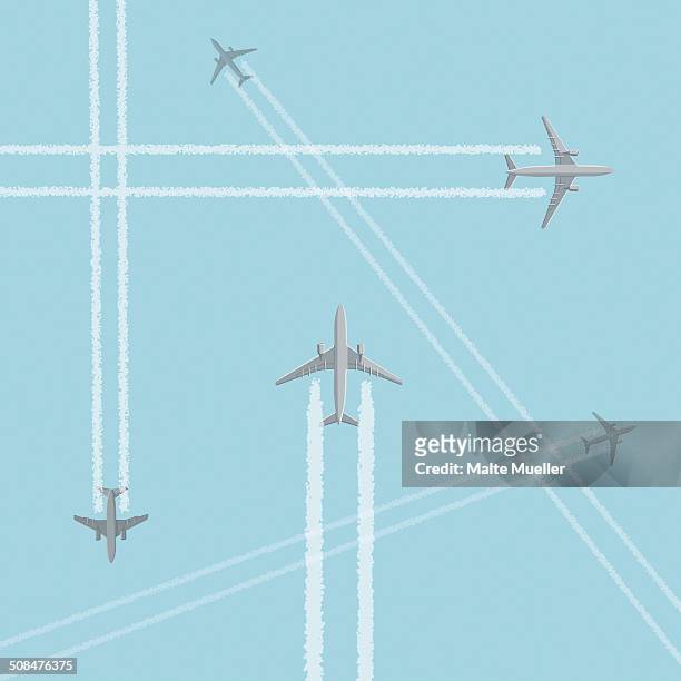 low angle view of airplanes with crisscross vapor trails against clear sky - aeroplane stock-grafiken, -clipart, -cartoons und -symbole
