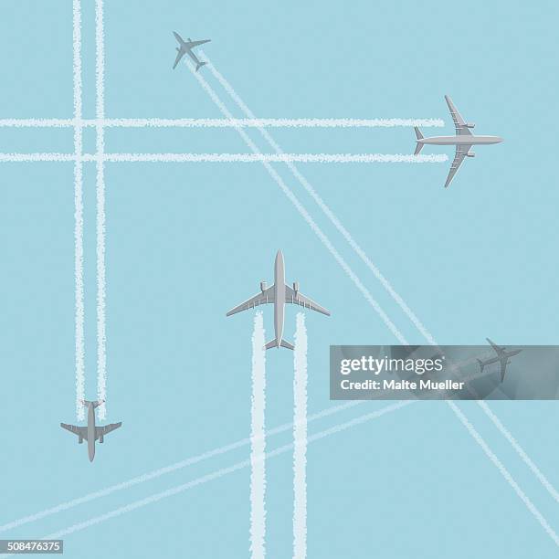 low angle view of airplanes with crisscross vapor trails against clear sky - vapor trail stock illustrations