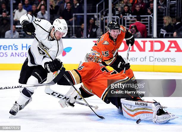 John Gibson of the Anaheim Ducks stops Kyle Clifford of the Los Angeles Kings on a shot in front of Sami Vatanen during the second period at Staples...