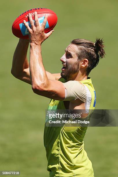 Dale Thomas, sporting a new hairstyle, marks the ball during a Carlton Blues AFL training session at Visy Park on February 5, 2016 in Melbourne,...