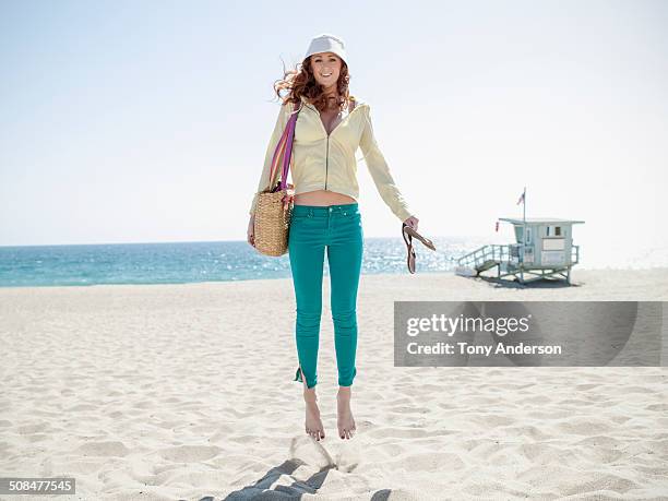 young woman at the beach - beach bag stock pictures, royalty-free photos & images