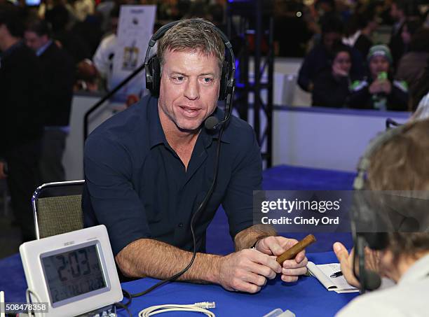 Former NFL player and sportscaster Troy Aikman visits the SiriusXM set at Super Bowl 50 Radio Row at the Moscone Center on February 4, 2016 in San...