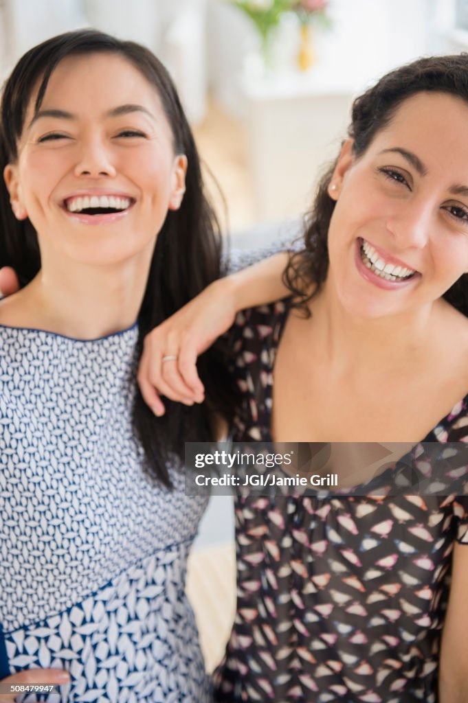 Smiling women standing together