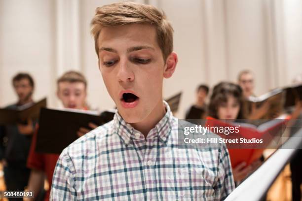 choir singer performing on stage - choir stage stock pictures, royalty-free photos & images