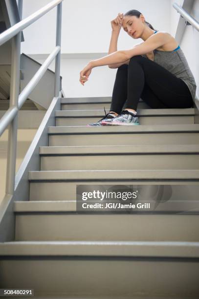 caucasian woman resting after exercise - atemlos stock-fotos und bilder