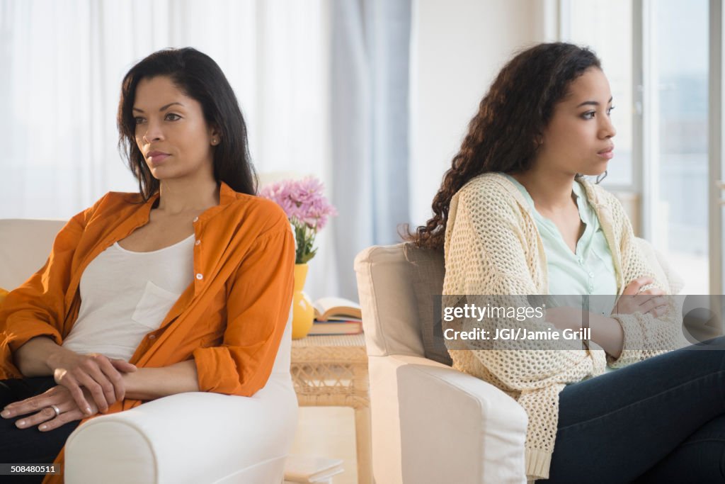 Mother and daughter arguing in living room