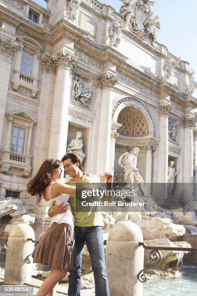 caucasian couple dancing outside fontana di trevi, rome, italy - tipo di danza fotografías e imágenes de stock