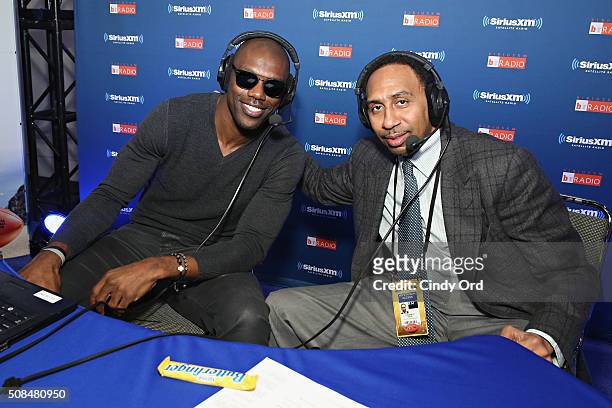 Former NFL player Terrell Owens and SiriusXM host Stephen A. Smith pose for a photo at SiriusXM's Super Bowl 50 Radio Row at the Moscone Center on...