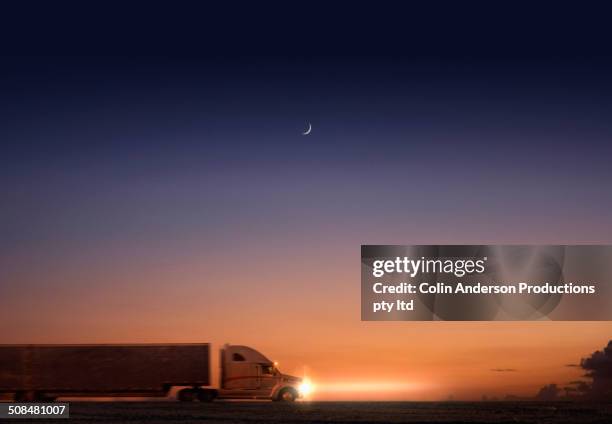 truck driving at sunset - road australia stockfoto's en -beelden