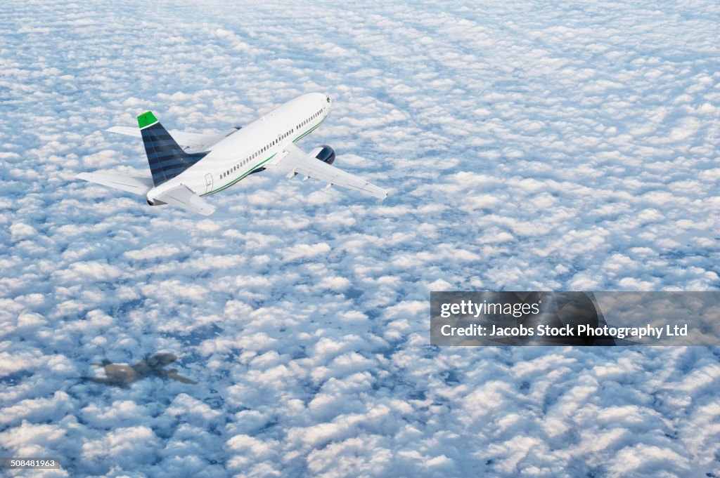 Airplane flying over clouds